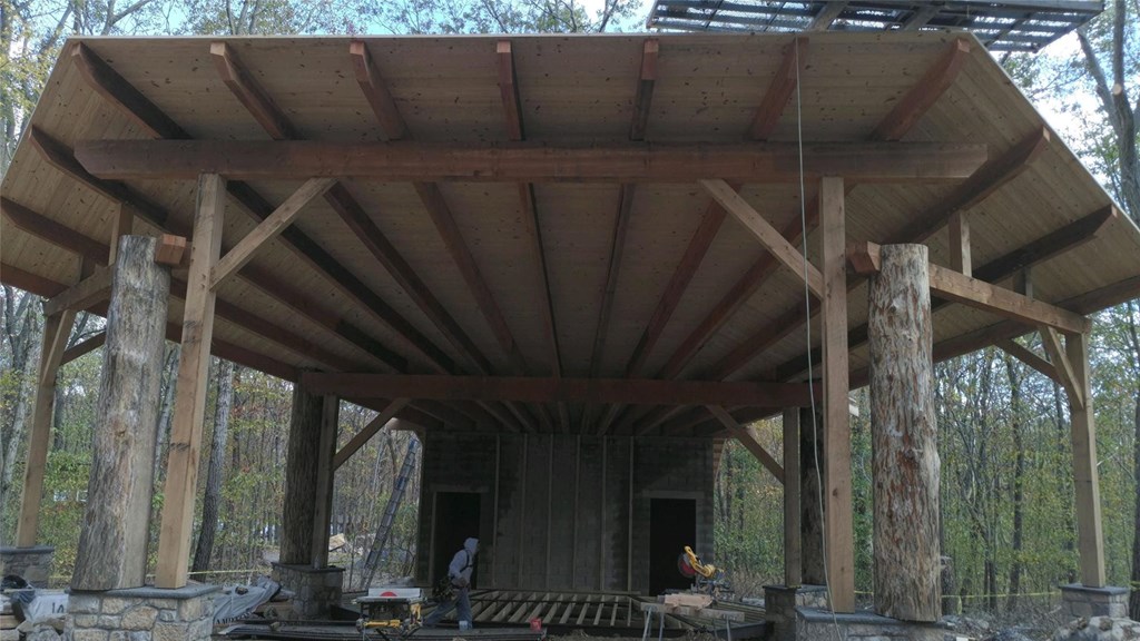 Outdoor amphitheater in progress, with structure and roof. 