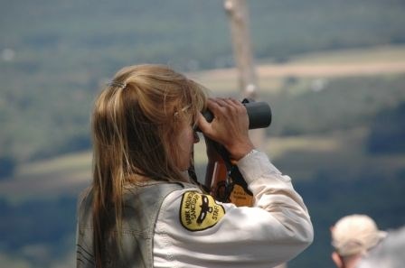 Laurie Goodrich using binoculars at North Lookout