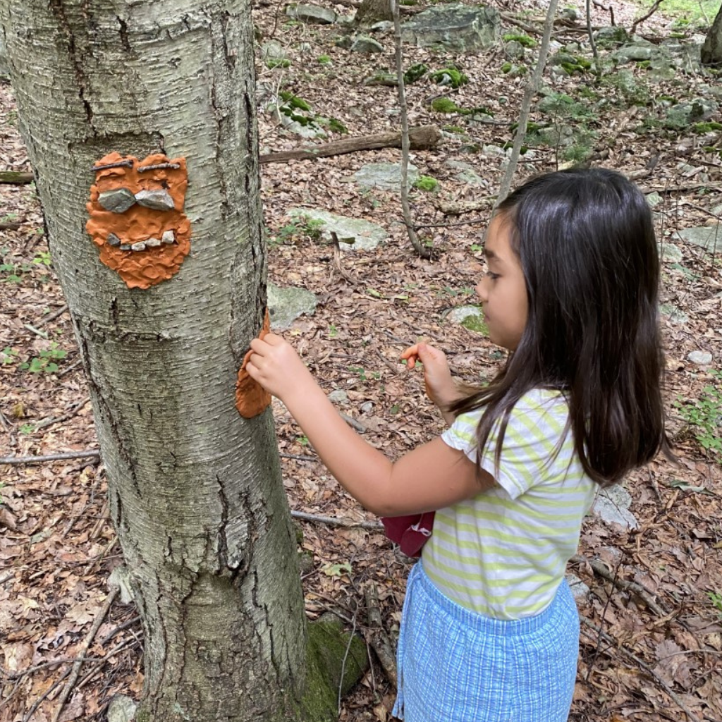 Camper doing a summer camp art activity Camper doing a summer camp art activity