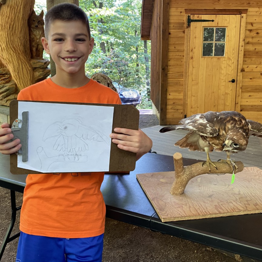 Camper doing a summer camp art activity Camper doing a summer camp art activity