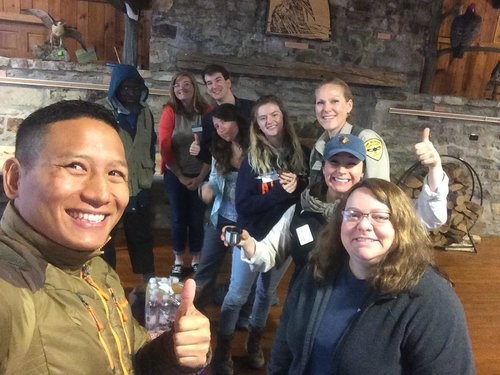 Spring 2019 trainees posing with Hawk Mountain staff in the Education Building.