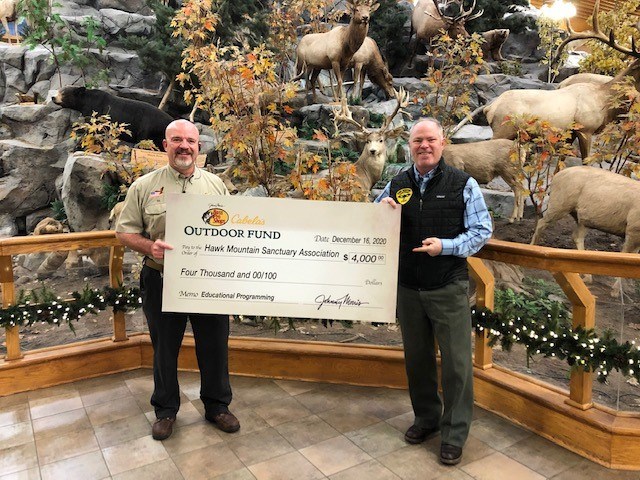 Hawk Mountain receives support from Cabela's Ed Barlotta presents Sean Grace with 4000 check