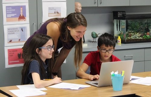 Zoey working with students