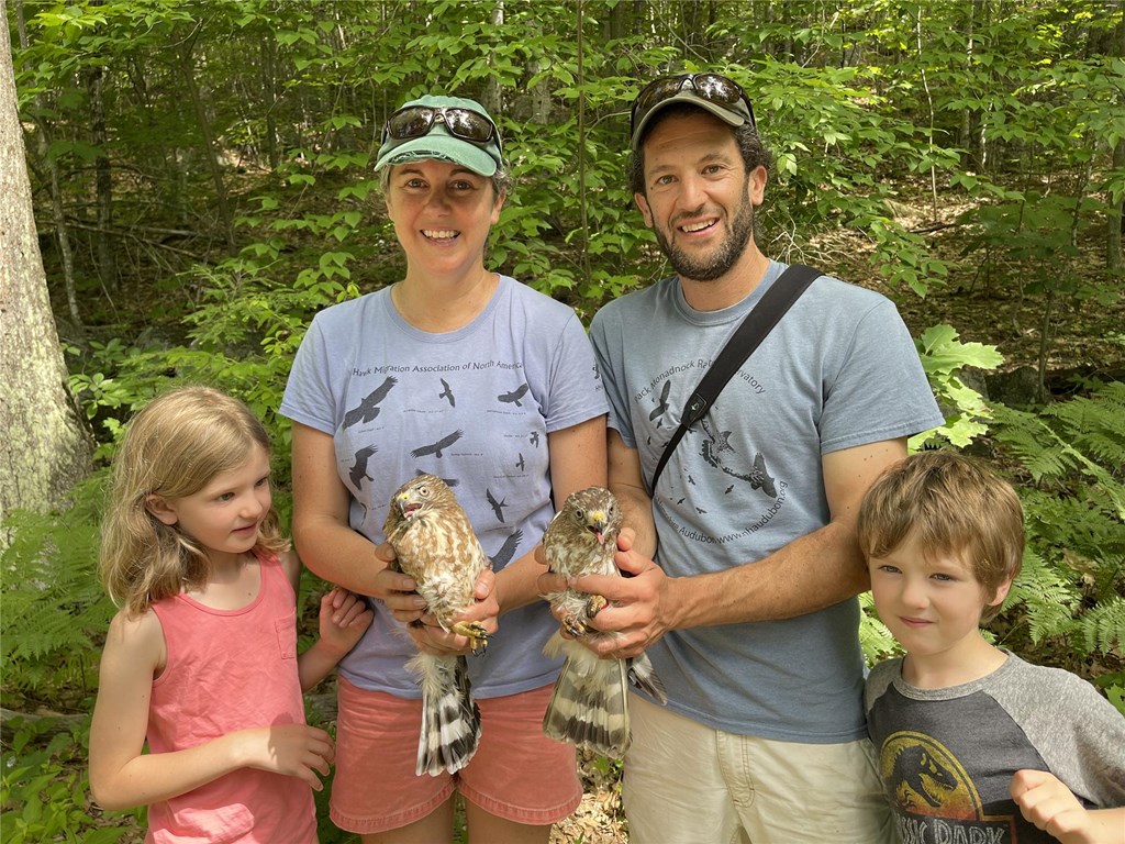 The Brown family with a pair of Broad-winged Hawks