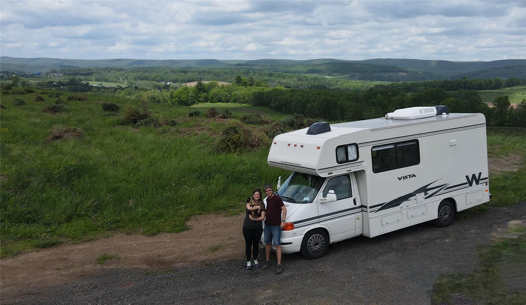 Fer and Emi pose with their motorhome