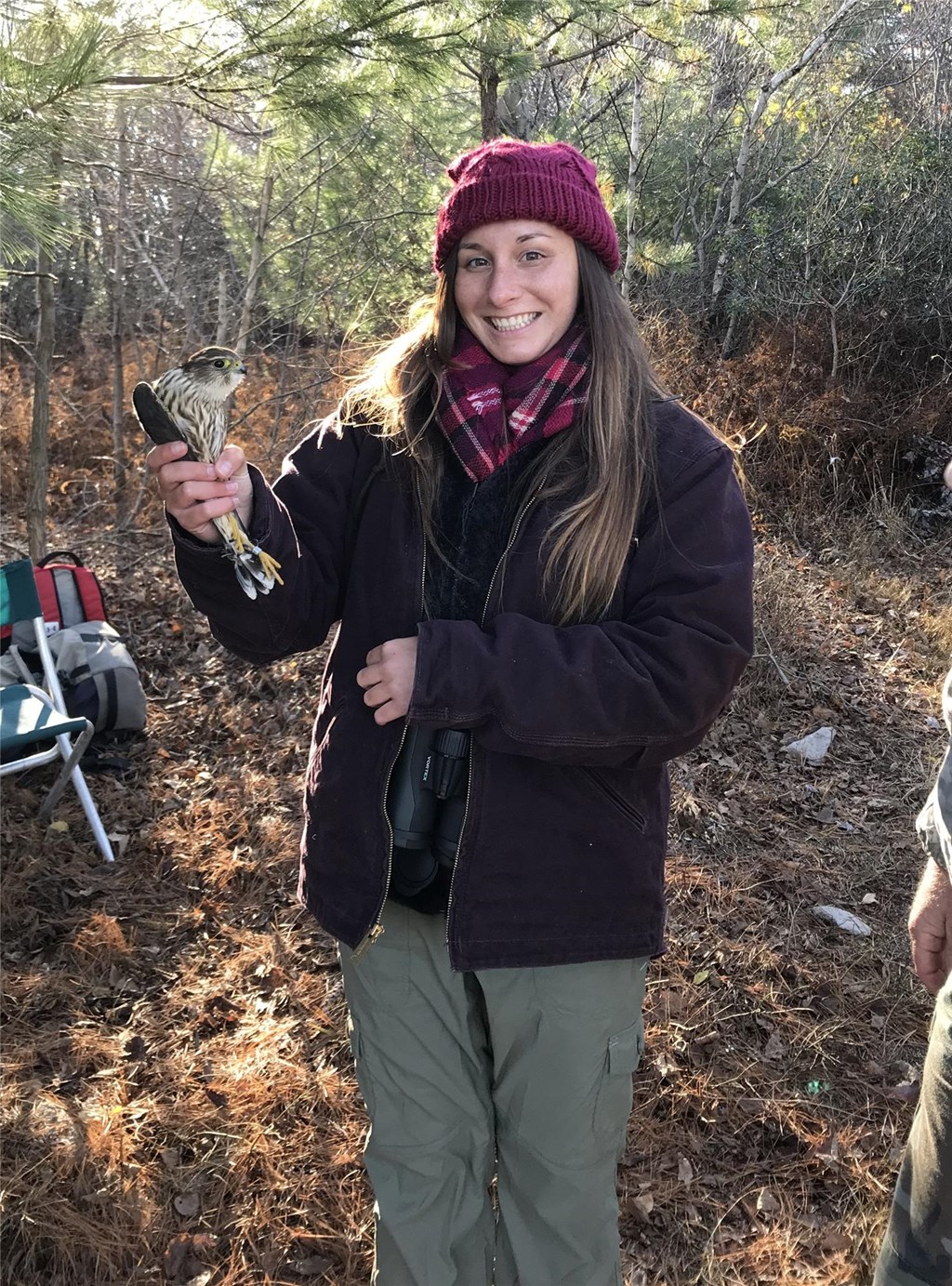 Alyssa holding a tagged merlin