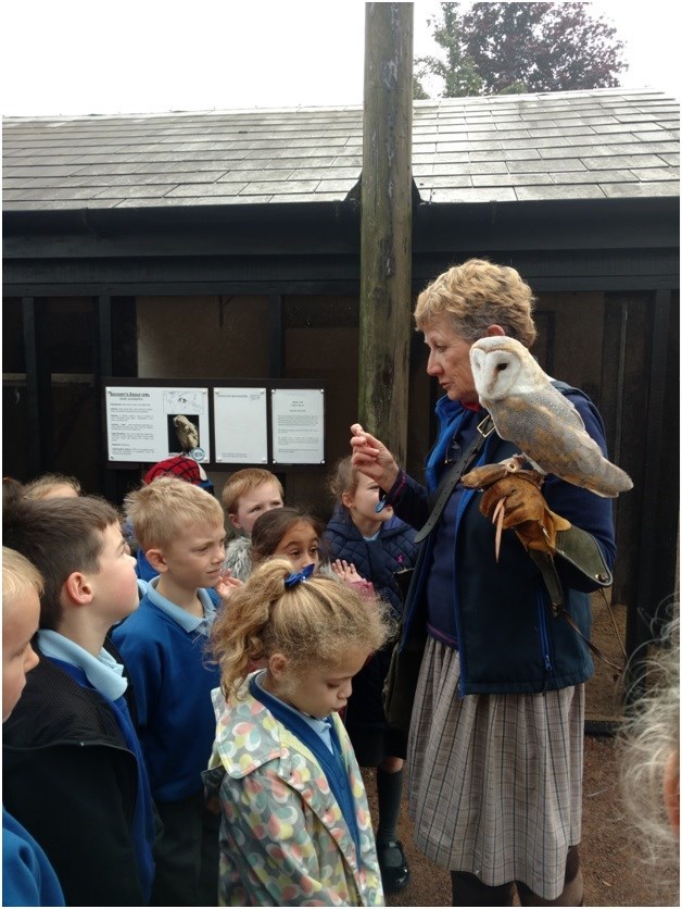 Jemima Parry-Jones and a barn owl welcom school children to ICBP.