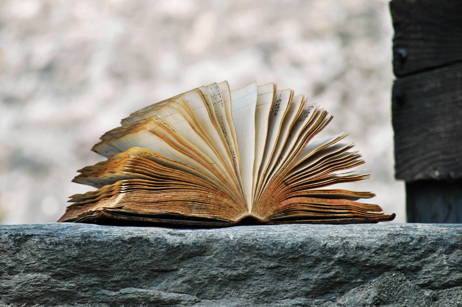 Book of stories on a rock ledge Book of stories on a rock ledge