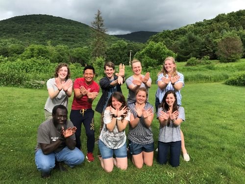 Trainees posing with a hawk hand symbol