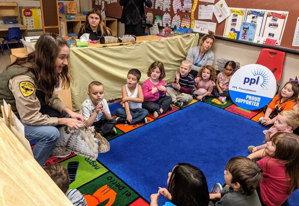 Educator Andrea teaching a raptor program in a Schuylkill County classroom