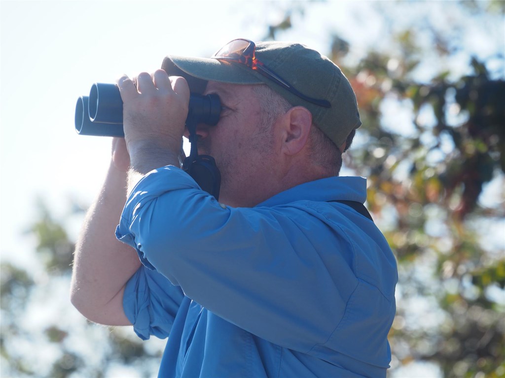 Sean Grace with binoculars