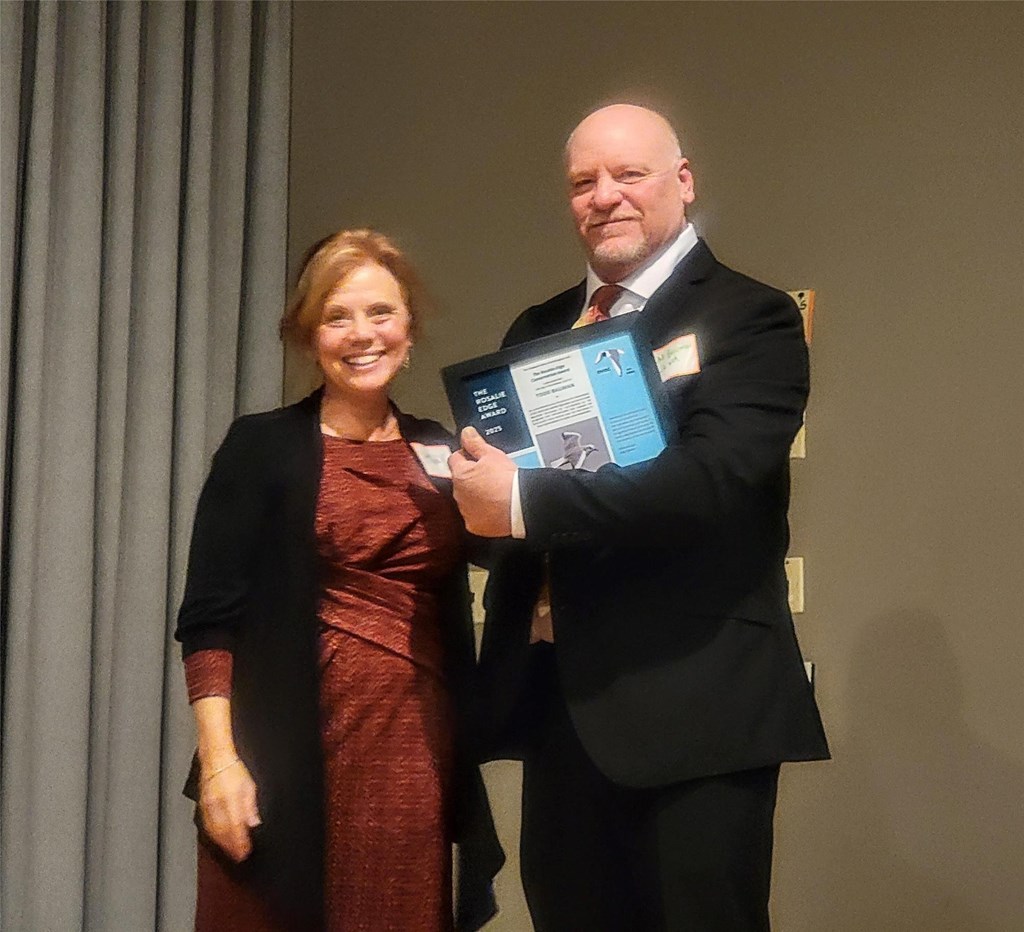 Holly Merker presents Todd Bauman DVOC Rosalie Edge Conservation Award 