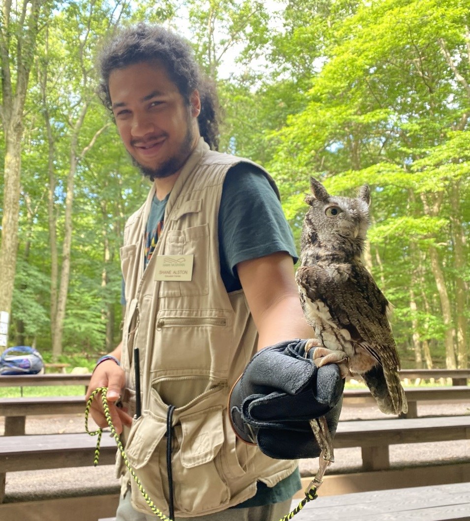 Education Trainee Shane with the Screech Owl Avian Ambassador