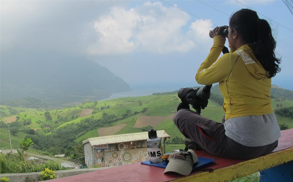 Camille at Count Former trainee looks out and conducts count with binoculars