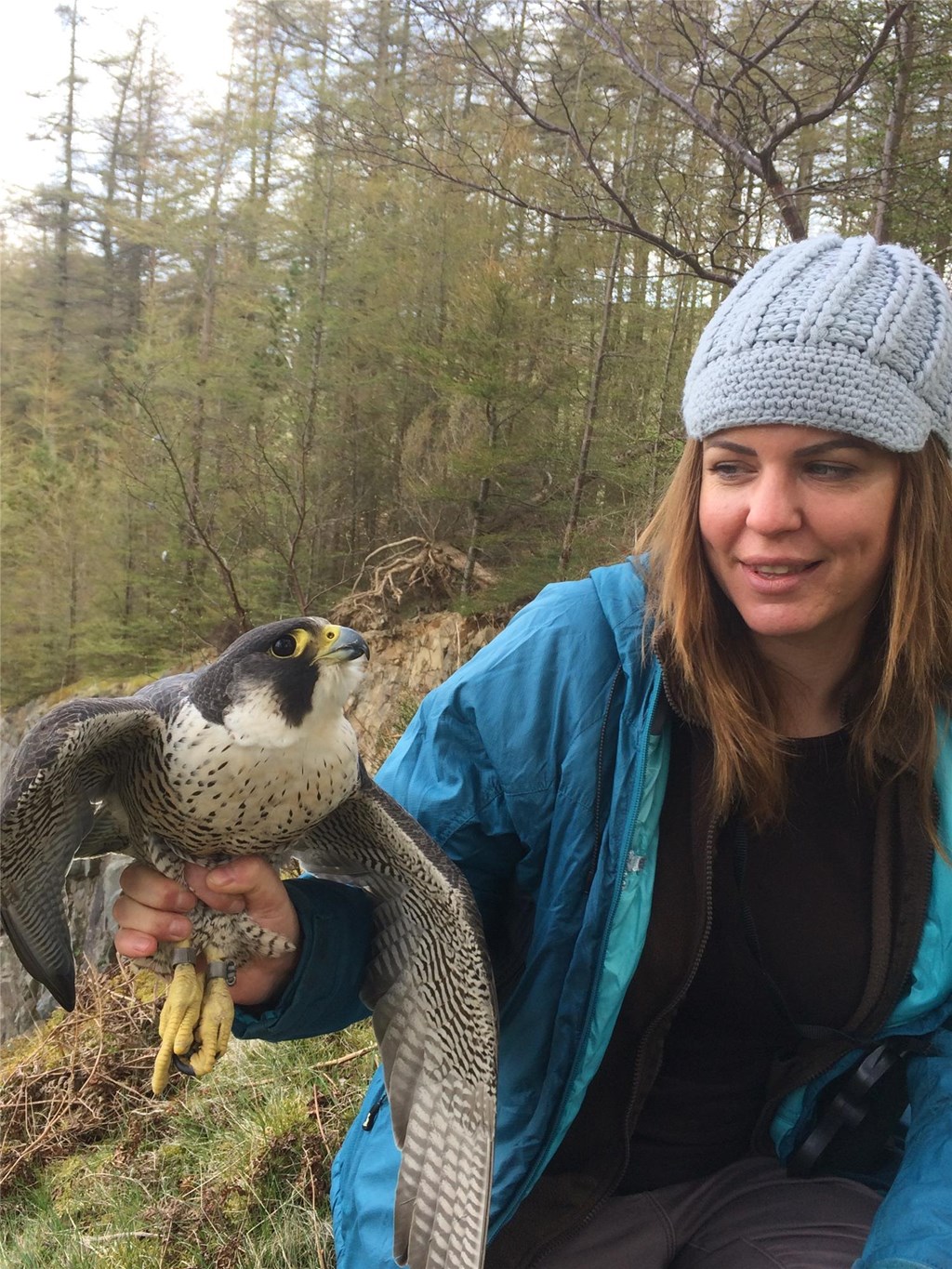 Zoe with a tagged bird in the field